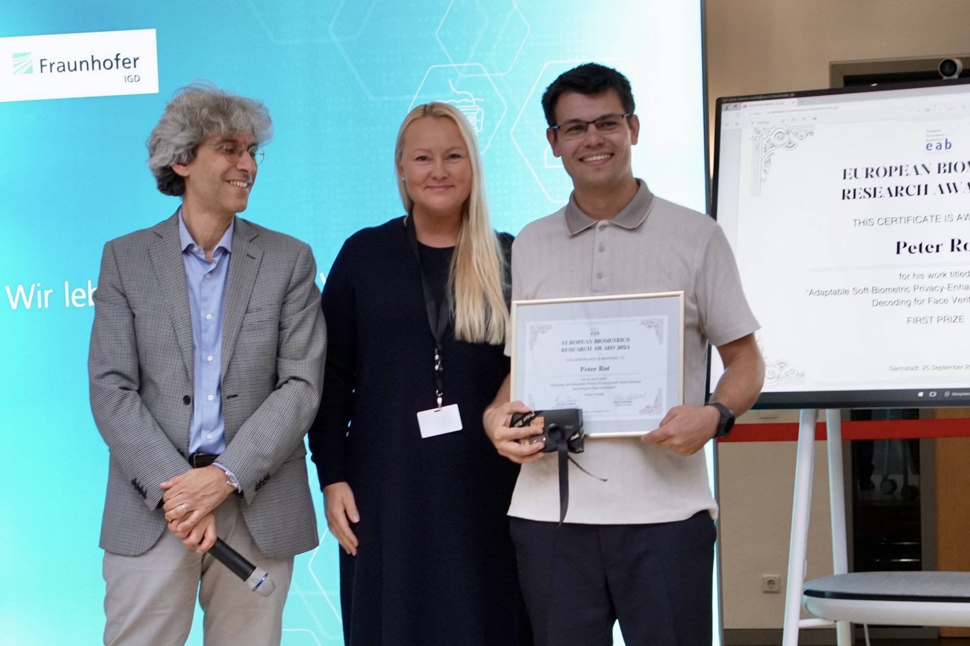 [Photo] Winner of the EAB Research Award Peter Rot together with Chairman of the Award Committee Prof. Patrizio Campisi and Chairperson of the European Association for Biometrics Frøy Løvåsdal